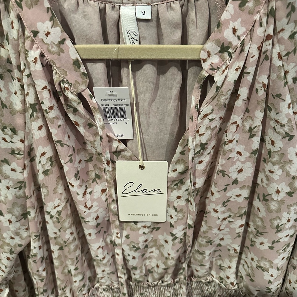 Elan smocked waist floral mini dress. BNWT. Size Med. Smoke and pet free home.